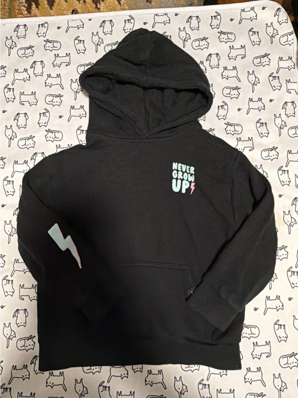 Little trouble Black Pullover Hoodie with 'Never Grow Up' Graphic